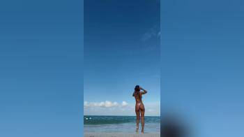 video of tanned latina on beach