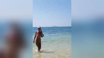 video of blond girl coming out of the sea for a look at her pussy