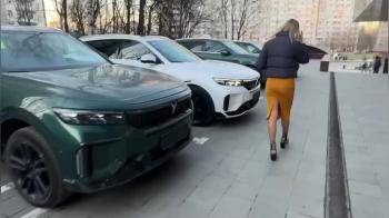 video of Hot blond walking to the car
