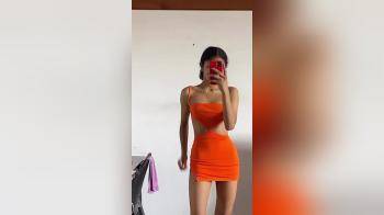 video of orange dress model body