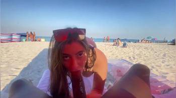 video of sexy girl doing blowjob on public beach