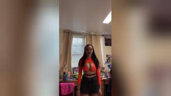 video of Her giant tits look good in orange
