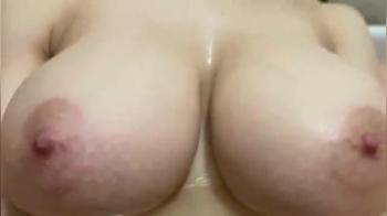 video of Play with her breasts in the bath