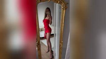 video of red dress in mirror