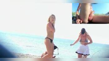 video of Dude sitting on the beach in front of some chicks