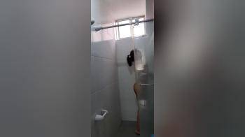 video of This Hot College Girl Plays Her Pussy In The Shower