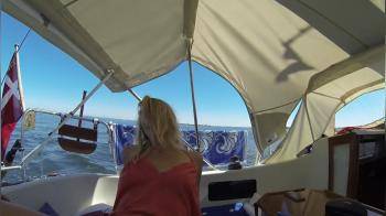 video of blonde rides the waves on a yacht