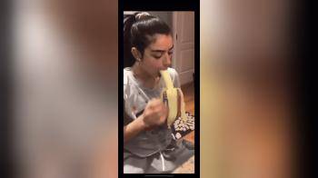 video of Gorgeous Brunette Demonstrates Her Throat Skills On a Banana