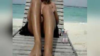 video of Sexy woman masturbating on beach