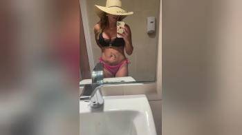 video of Floppy Hat Fingering In A Restroom