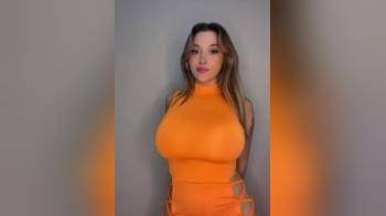 video of Bouncy in an orange dress