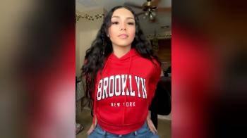 video of Beauty in red sweater