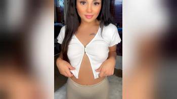 video of White top tan skirt