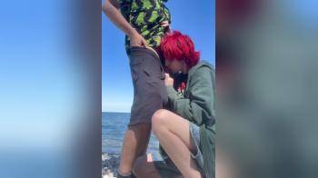 video of girl blows on the beach