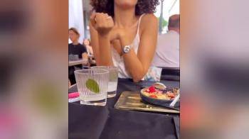 video of Horny slut opens legs under table while eating