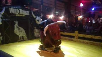 video of Bull riding with short skirt thong