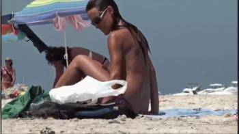 video of milf tanning on the beach