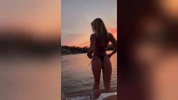 video of tiny bikini at sunset