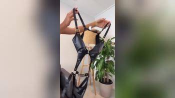 video of reveal of leather lingerie