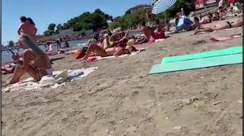 video of Guy finger her pussy on a public beach