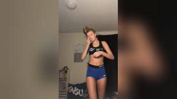 video of Cute cheerleader takes top off