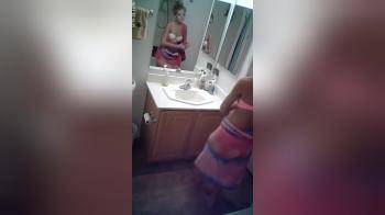 video of Changing out of her bathing suit