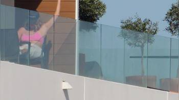 video of Neighbor sunbathing and caressing her tits_2