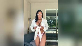 video of Hot black woman posing in white shirt