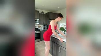 video of Woman posing in a red mini dress
