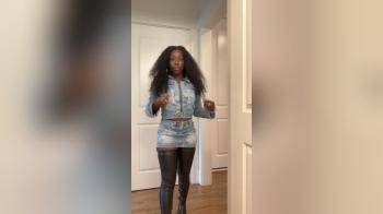 video of Black woman posing in denim