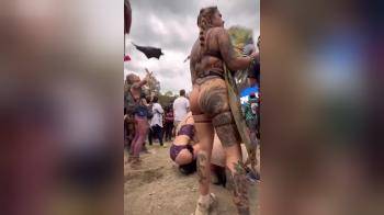 video of Heavily tattooed festival girl