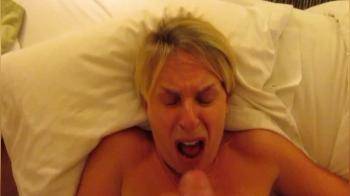 video of Short haired blonde slut has an orgasm while getting a hot cum facial