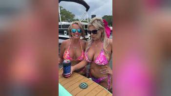 video of two wives in bikini on a boat