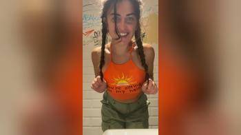 video of Showing her tits in a public bathroom