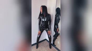 video of Black woman posing in catsuit