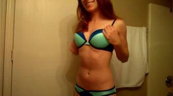 video of beautiful ginger removes her bra
