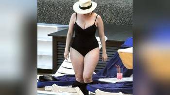 video of black swimsuit turn away