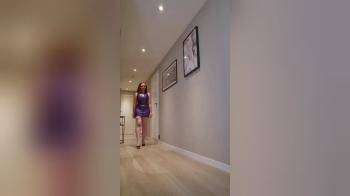 video of Red head posing in PVC outfit