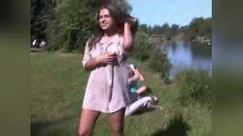 video of Gets naked by a pond