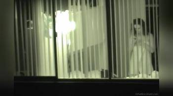 video of Cute chick  through window