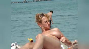 video of big oily boobs on the beach